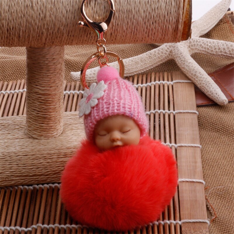 sleeping baby doll keychain